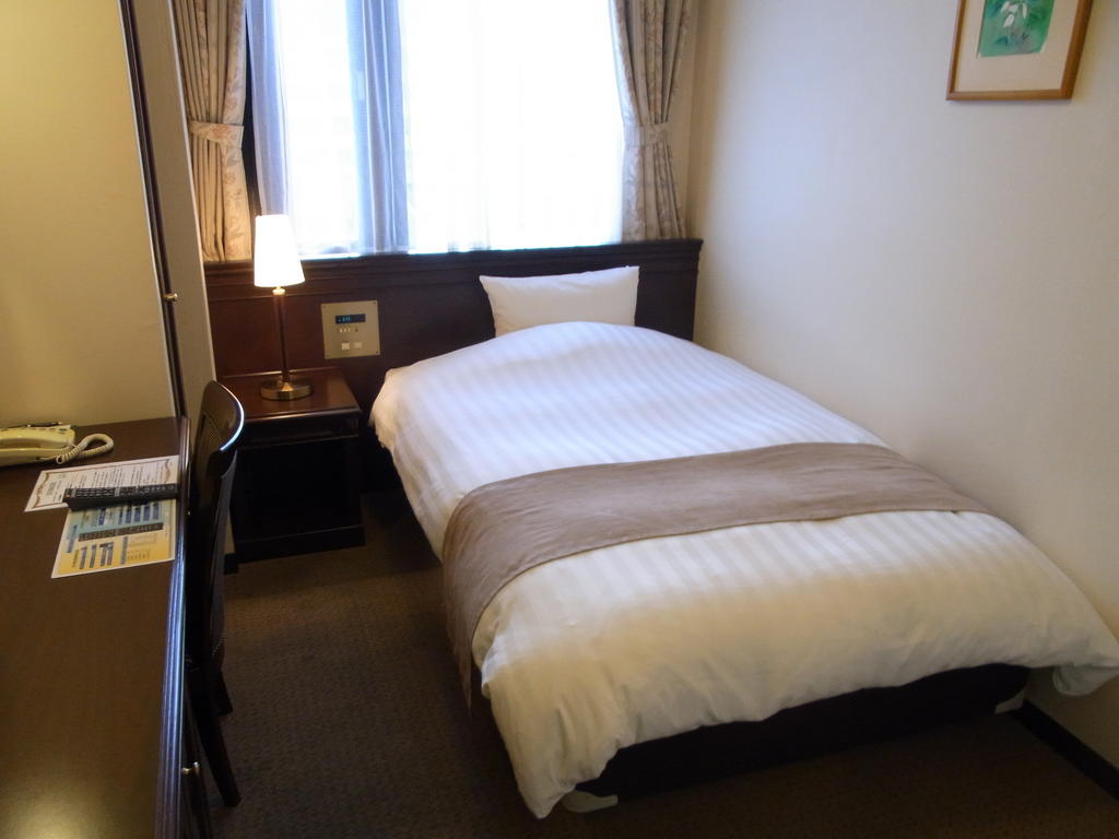 Amami Sunplaza Hotel Quarto foto